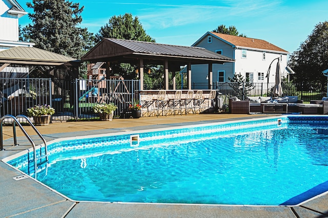 view of pool featuring a patio and a gazebo