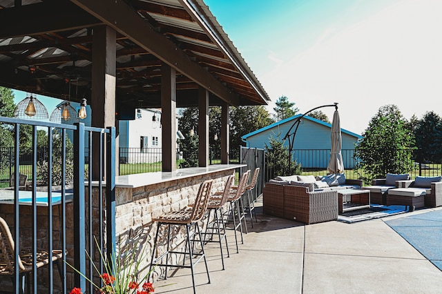 view of patio / terrace with an outdoor hangout area and exterior bar