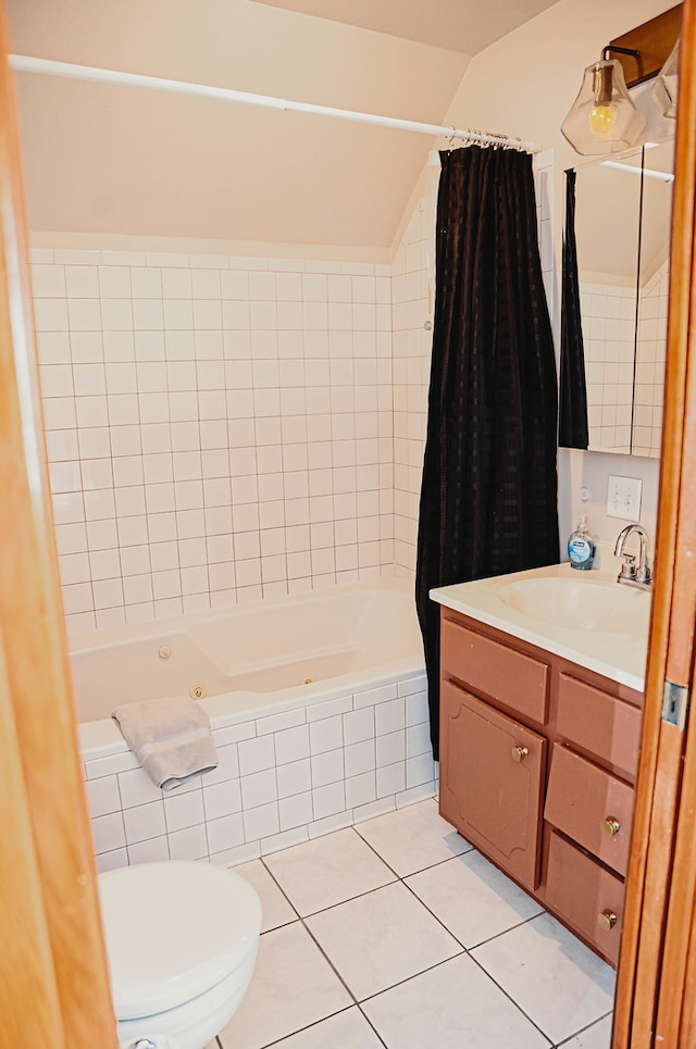 full bathroom with tile patterned floors, toilet, shower / tub combo with curtain, and vanity