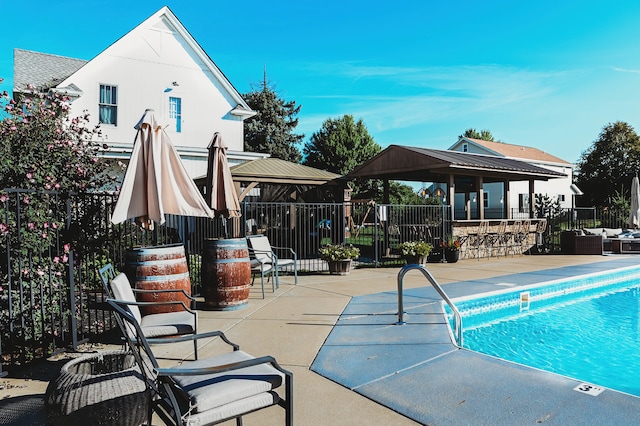 view of pool with a gazebo and a patio