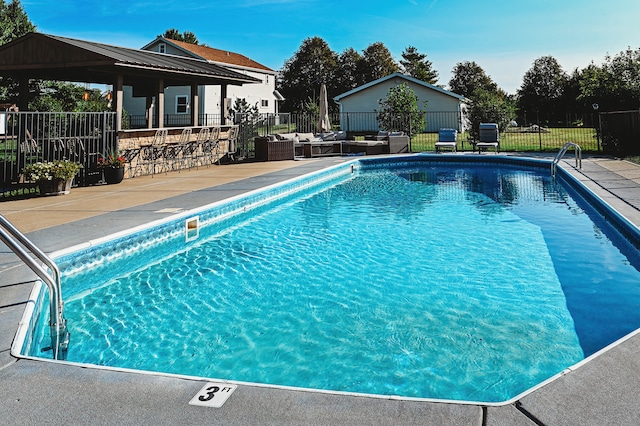 view of swimming pool with a patio