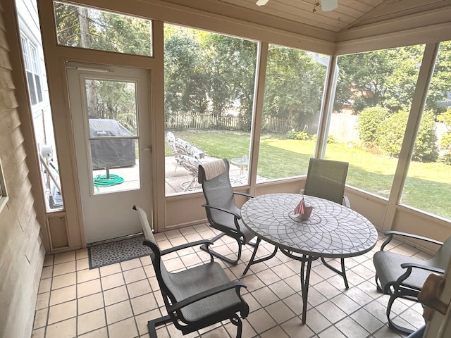 sunroom featuring lofted ceiling