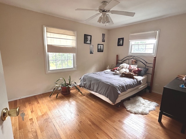 bedroom with light wood-type flooring and ceiling fan