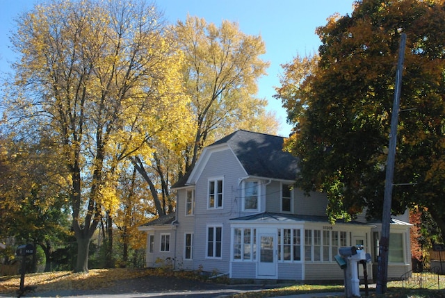 view of front of property with a sunroom