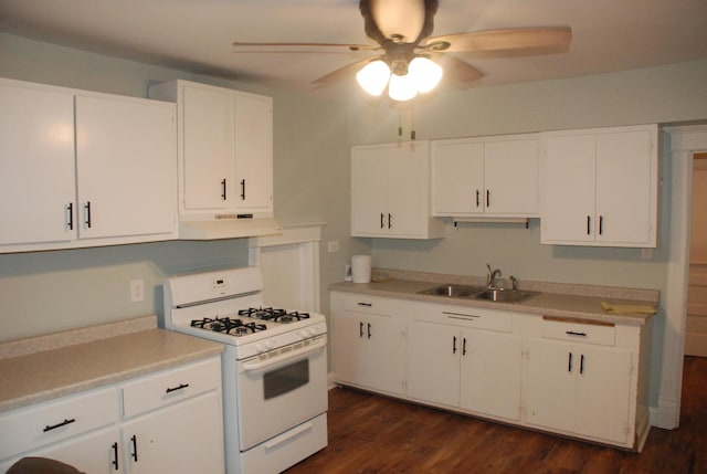 kitchen with sink, white cabinets, white gas range oven, ceiling fan, and dark hardwood / wood-style flooring