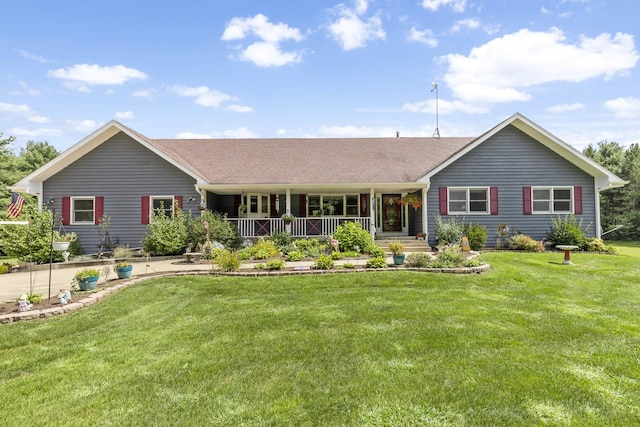 rear view of house featuring a lawn and a porch