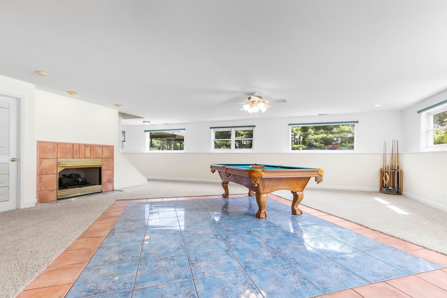 playroom with ceiling fan, billiards, a tiled fireplace, and light carpet