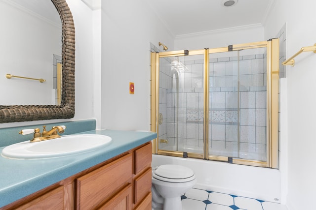 full bathroom with tile patterned floors, toilet, vanity, and ornamental molding