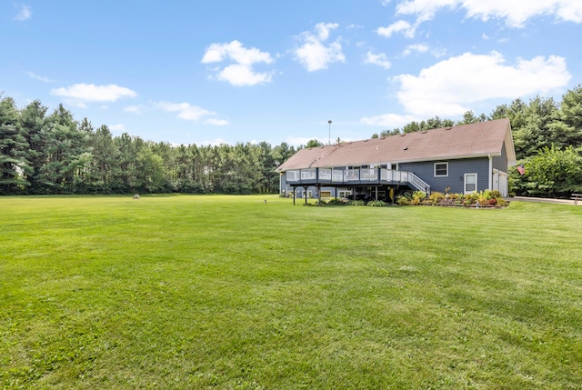 view of yard with a wooden deck