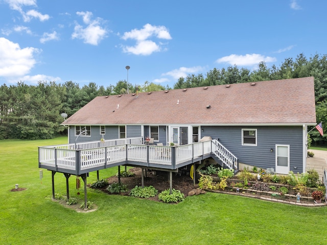 back of property featuring a yard and a deck