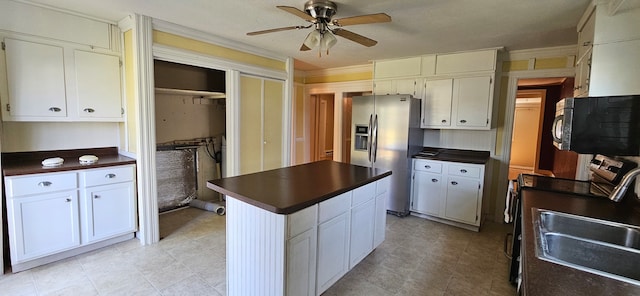 kitchen featuring ceiling fan, white cabinets, appliances with stainless steel finishes, and light tile patterned flooring