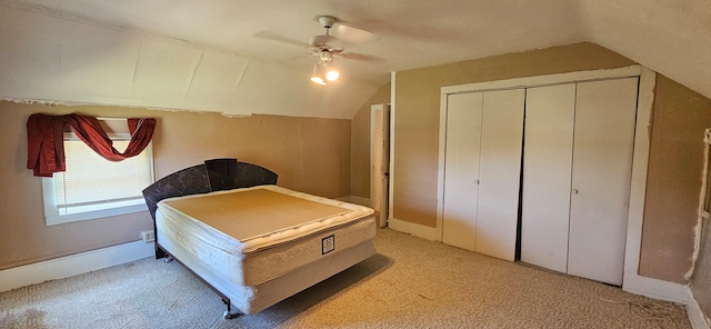 bedroom with light colored carpet, vaulted ceiling, and ceiling fan