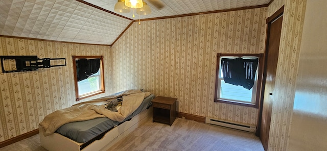 bedroom with ceiling fan, a baseboard radiator, crown molding, and lofted ceiling