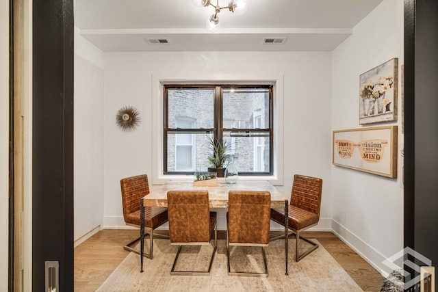 dining room featuring light hardwood / wood-style floors