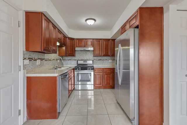 1781 Queensbury Cir, Hoffman Estates, IL 60169 - kitchen with stainless steel appliances, under cabinet range hood, light countertops, decorative backsplash, and light tile patterned floors