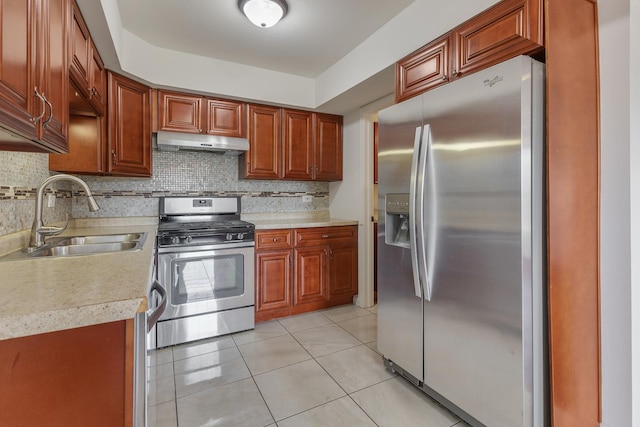 1781 Queensbury Cir, Hoffman Estates, IL 60169 - kitchen featuring appliances with stainless steel finishes, under cabinet range hood, light countertops, tasteful backsplash, and light tile patterned floors
