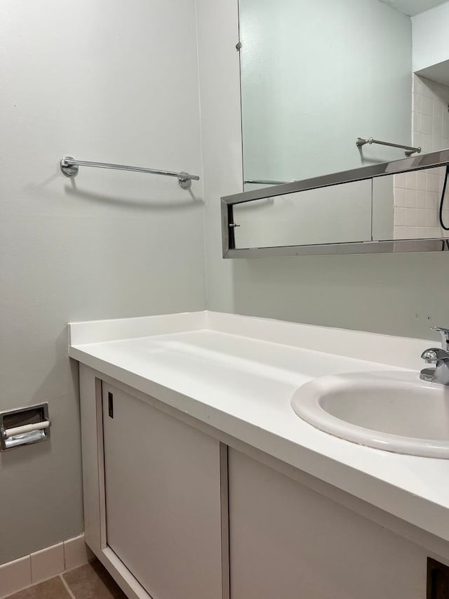 bathroom with tile patterned floors and vanity