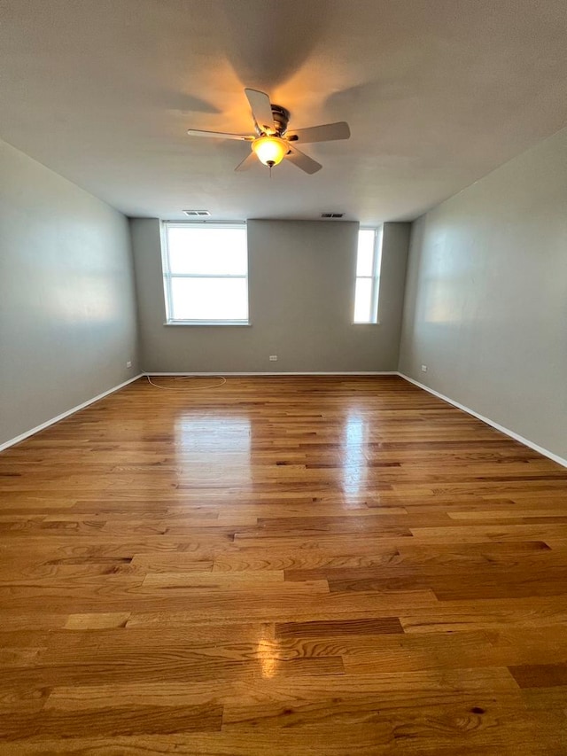 unfurnished room featuring light hardwood / wood-style flooring and ceiling fan