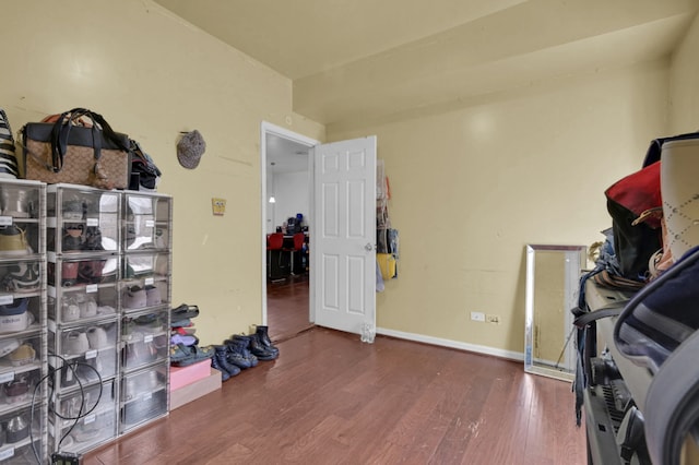 exercise room featuring dark hardwood / wood-style floors