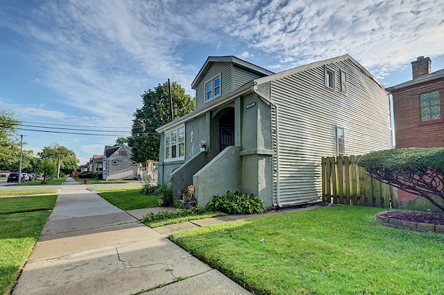 view of front of home with a front lawn