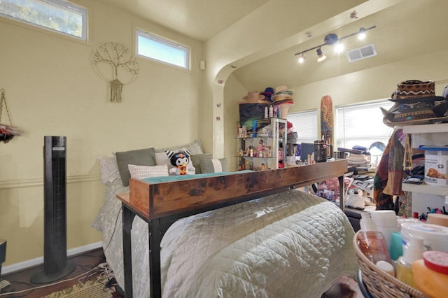 bedroom featuring track lighting