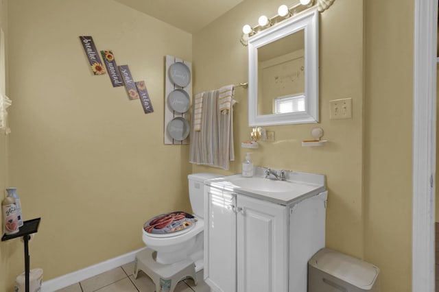 bathroom featuring vanity, toilet, and tile patterned floors