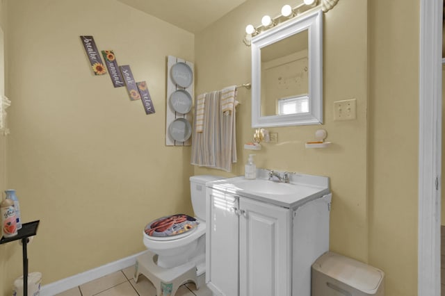 bathroom featuring vanity, toilet, and tile patterned floors