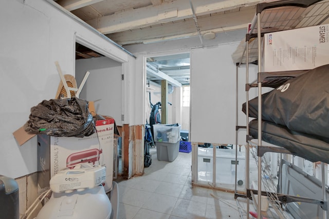 basement featuring light tile patterned floors