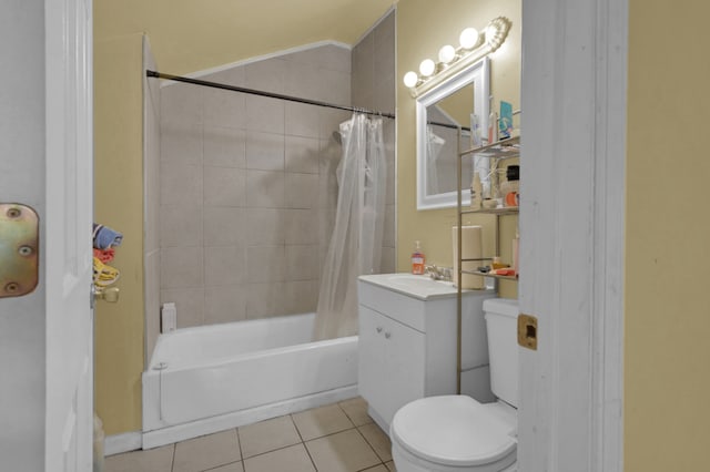 full bathroom with tile patterned flooring, toilet, shower / tub combo with curtain, and vanity