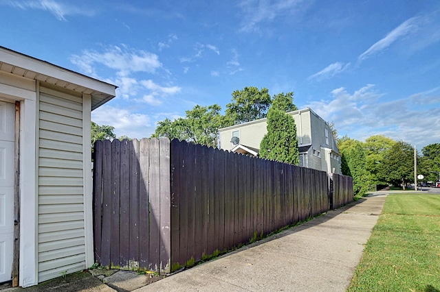 view of home's exterior with a lawn