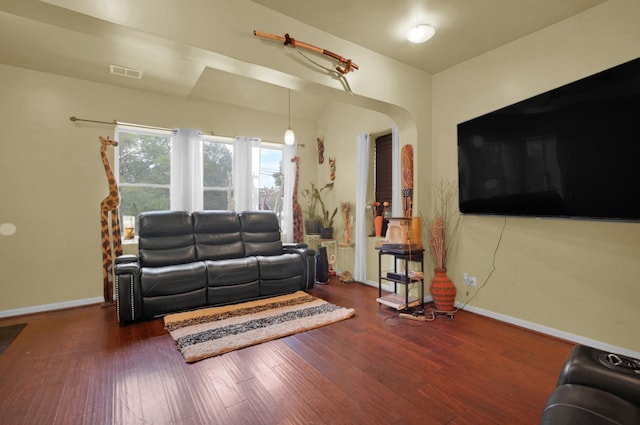 living room featuring dark wood-type flooring