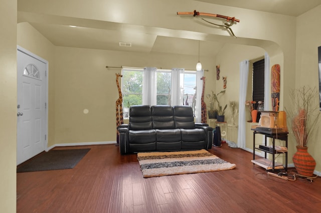 living room with dark hardwood / wood-style flooring