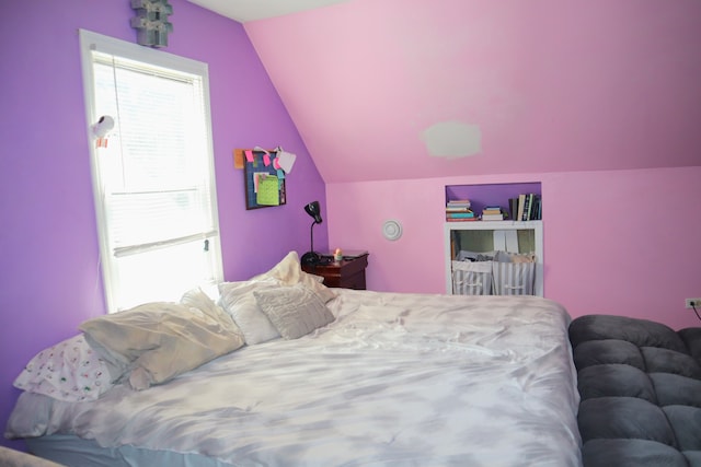 bedroom featuring vaulted ceiling