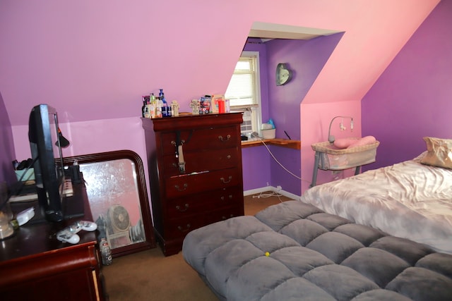 carpeted bedroom with vaulted ceiling