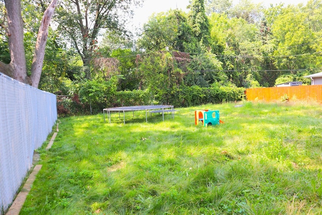 view of yard with a trampoline