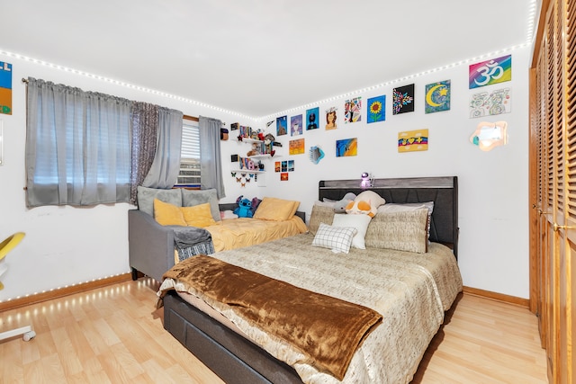 bedroom with light hardwood / wood-style flooring