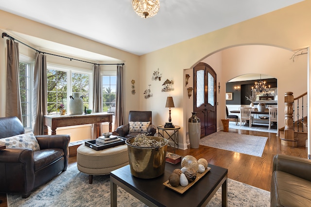 living room featuring a notable chandelier and hardwood / wood-style floors