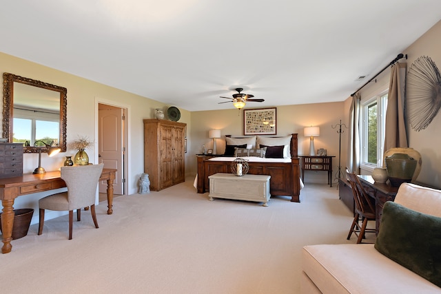 bedroom featuring ceiling fan and light colored carpet