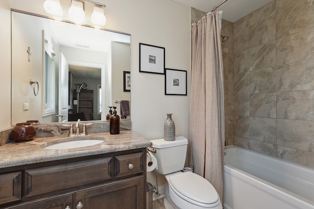 full bathroom with shower / bath combination with curtain, vanity, and toilet