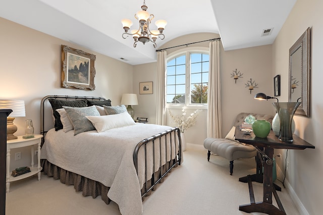 bedroom featuring carpet and a chandelier