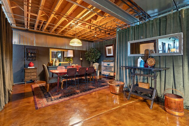 dining room featuring concrete floors