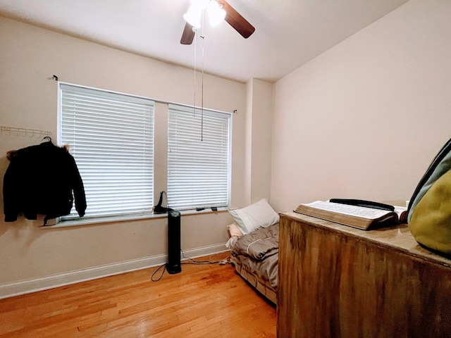 sitting room featuring hardwood / wood-style flooring and ceiling fan