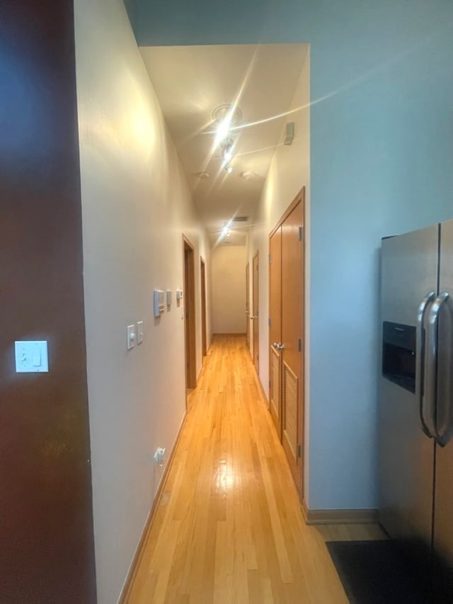 hall with light hardwood / wood-style flooring