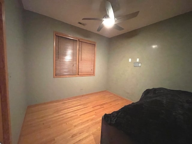 interior space featuring hardwood / wood-style flooring and ceiling fan