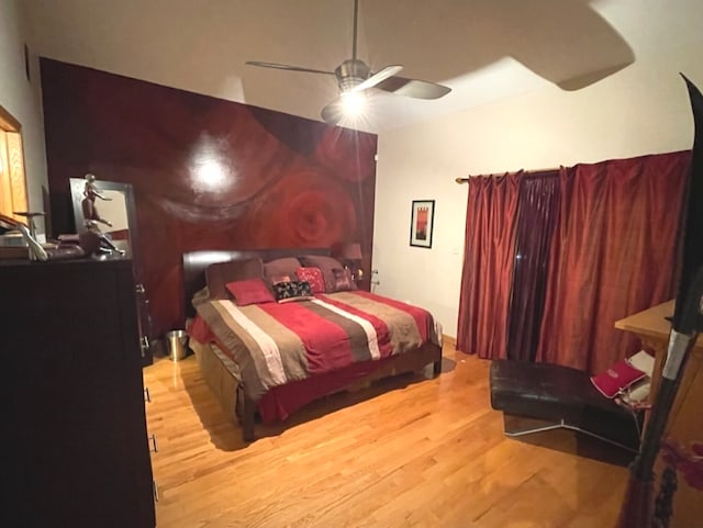 bedroom with light hardwood / wood-style flooring and ceiling fan