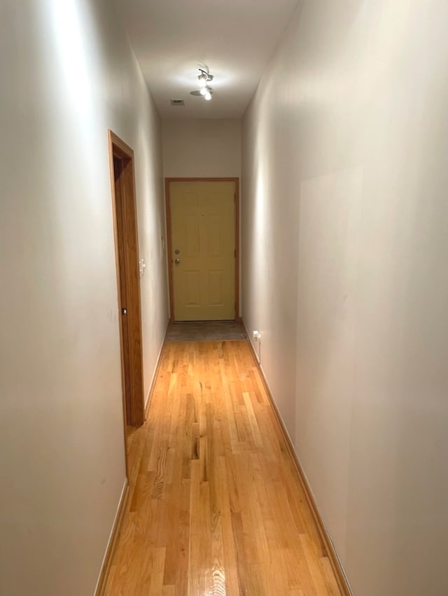 hallway featuring light hardwood / wood-style flooring