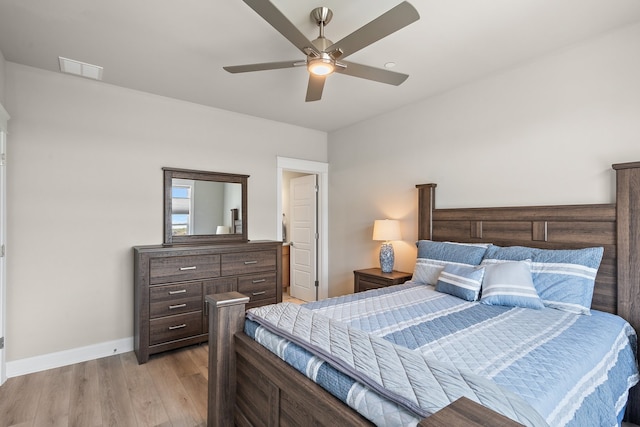 bedroom with light wood-type flooring and ceiling fan