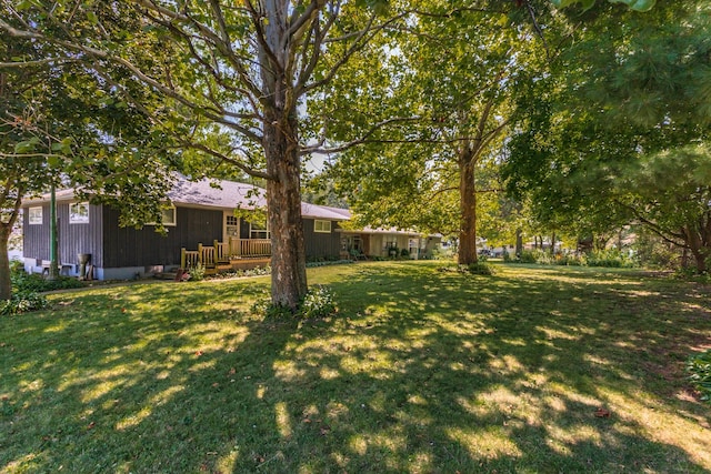 view of yard featuring a wooden deck