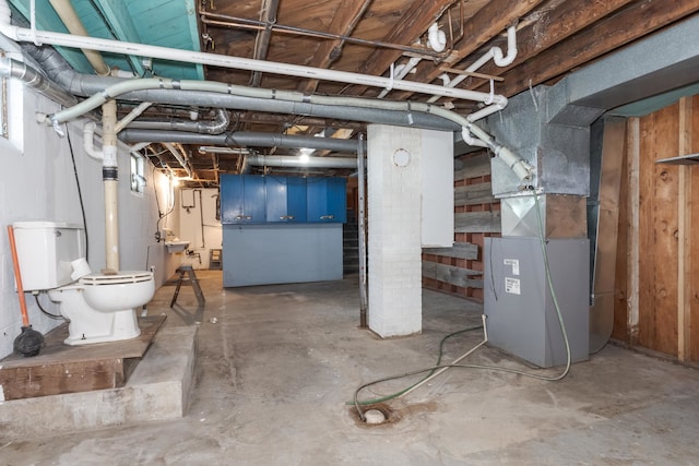 basement featuring heating unit