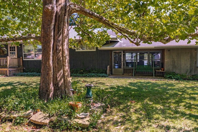 view of yard with a sunroom